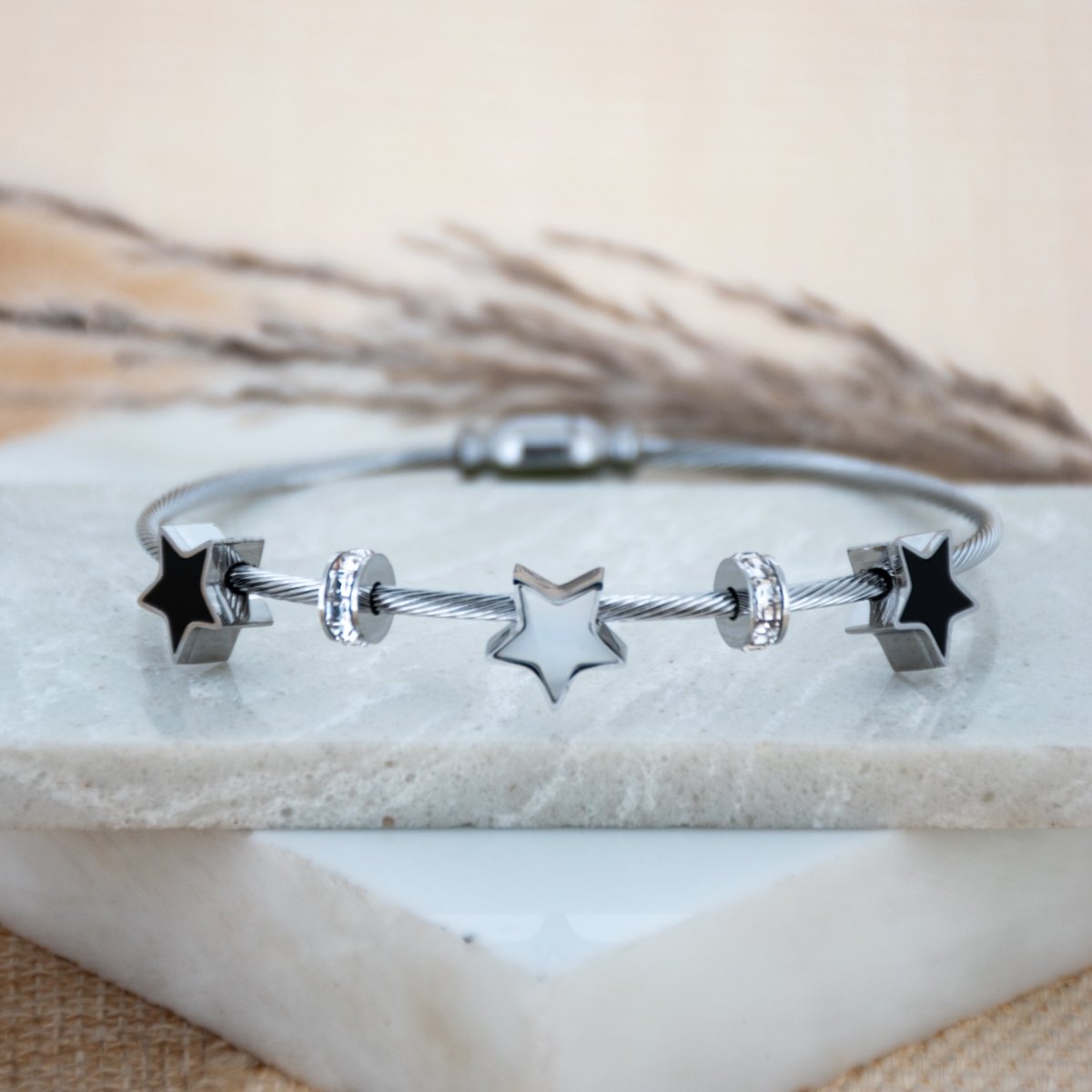 Elegant star bangle with delicate celestial detailing and an anti-tarnish finish, available in rosegold, perfect for everyday wear, youthful styling, and chic minimal looks.