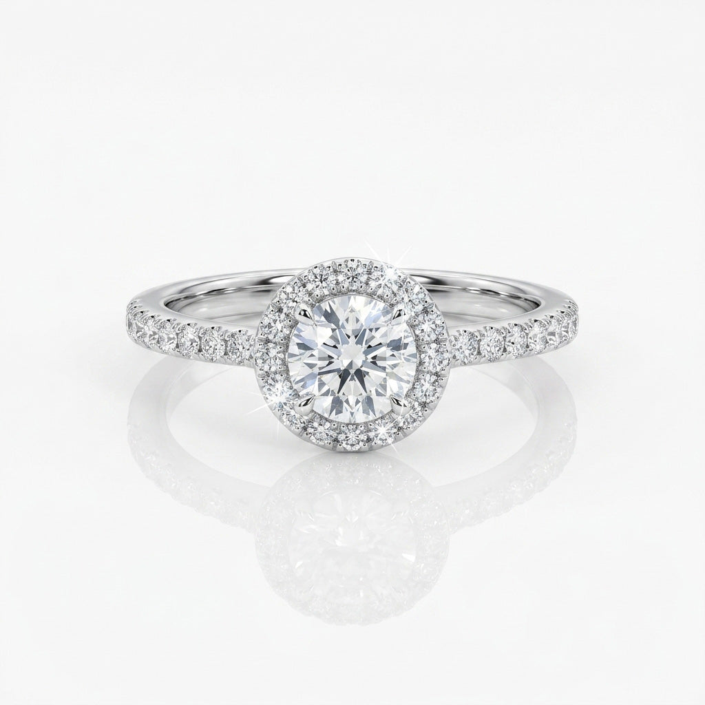 Clean Cut Halo Ring with a round-cut center stone, sparkling halo setting, and slim pavé band for sleek, timeless elegance.