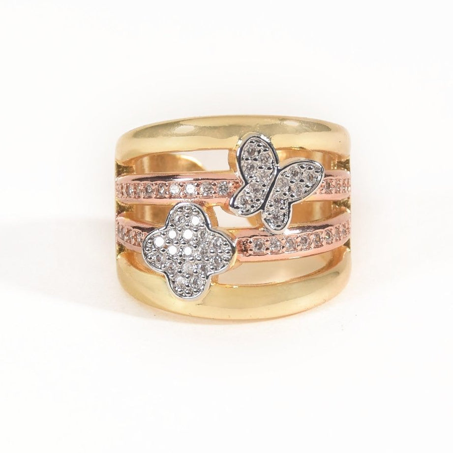 Luxurious golden multi-band ring with sparkling clover and butterfly motifs in an anti-tarnish finish. perfect for statement styling, elegant occasions, and everyday glamour.
