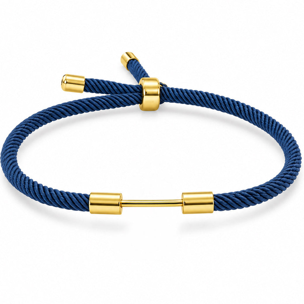 Navy blue woven cord bracelet with a polished gold dumbbell charm and adjustable slider bead on a white background.