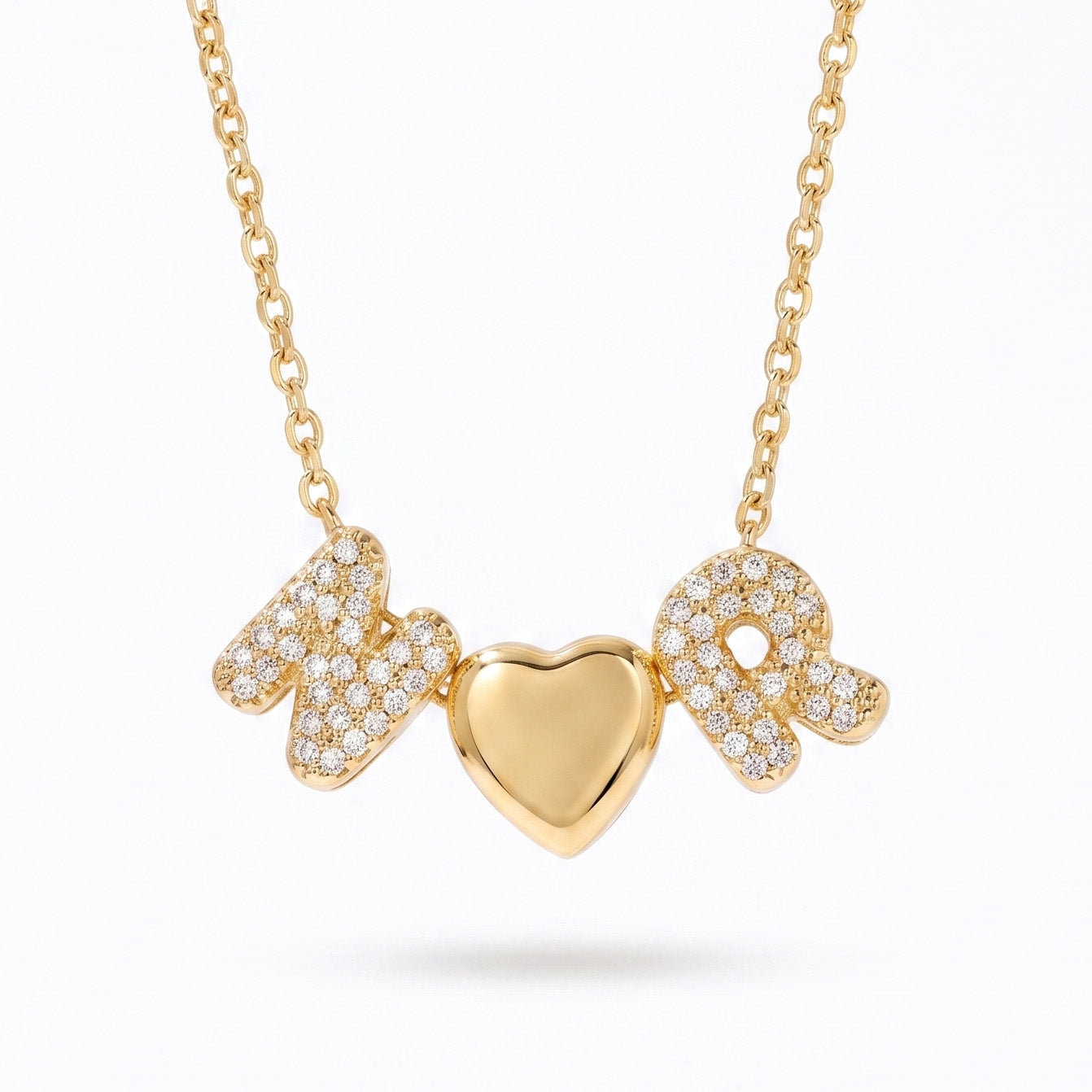 Gold couple initial necklace featuring sparkling N and R letter charms with a polished heart centerpiece on a gold chain against a white background.