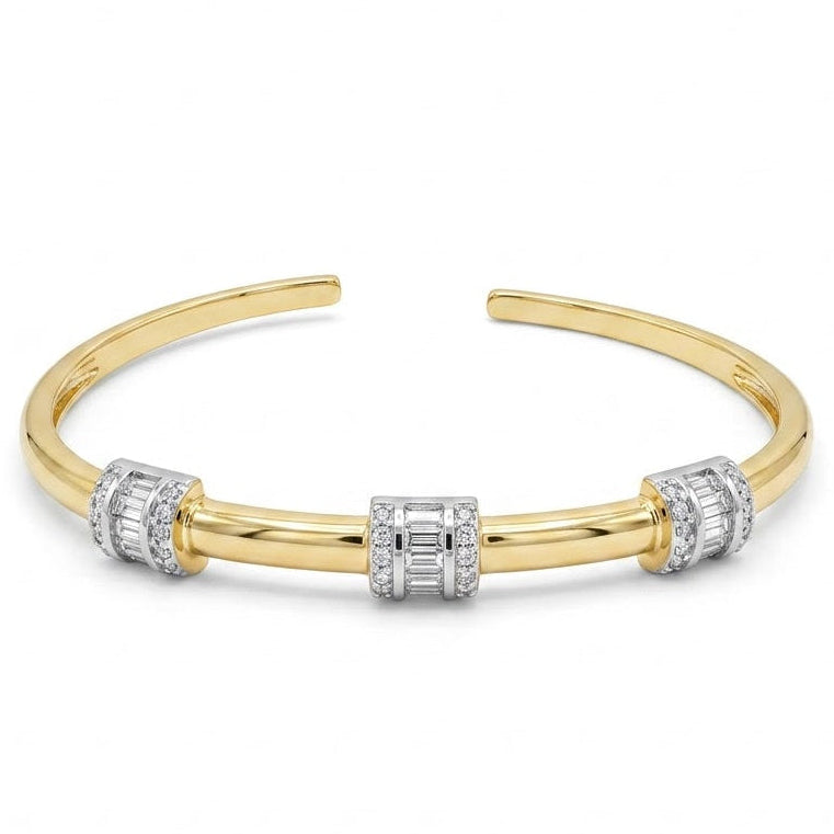 Anti-tarnish yellow gold open cuff bracelet featuring three silver-tone cylindrical barrel stations set with central baguette-cut cubic zirconia and outer pavé borders on a polished band.