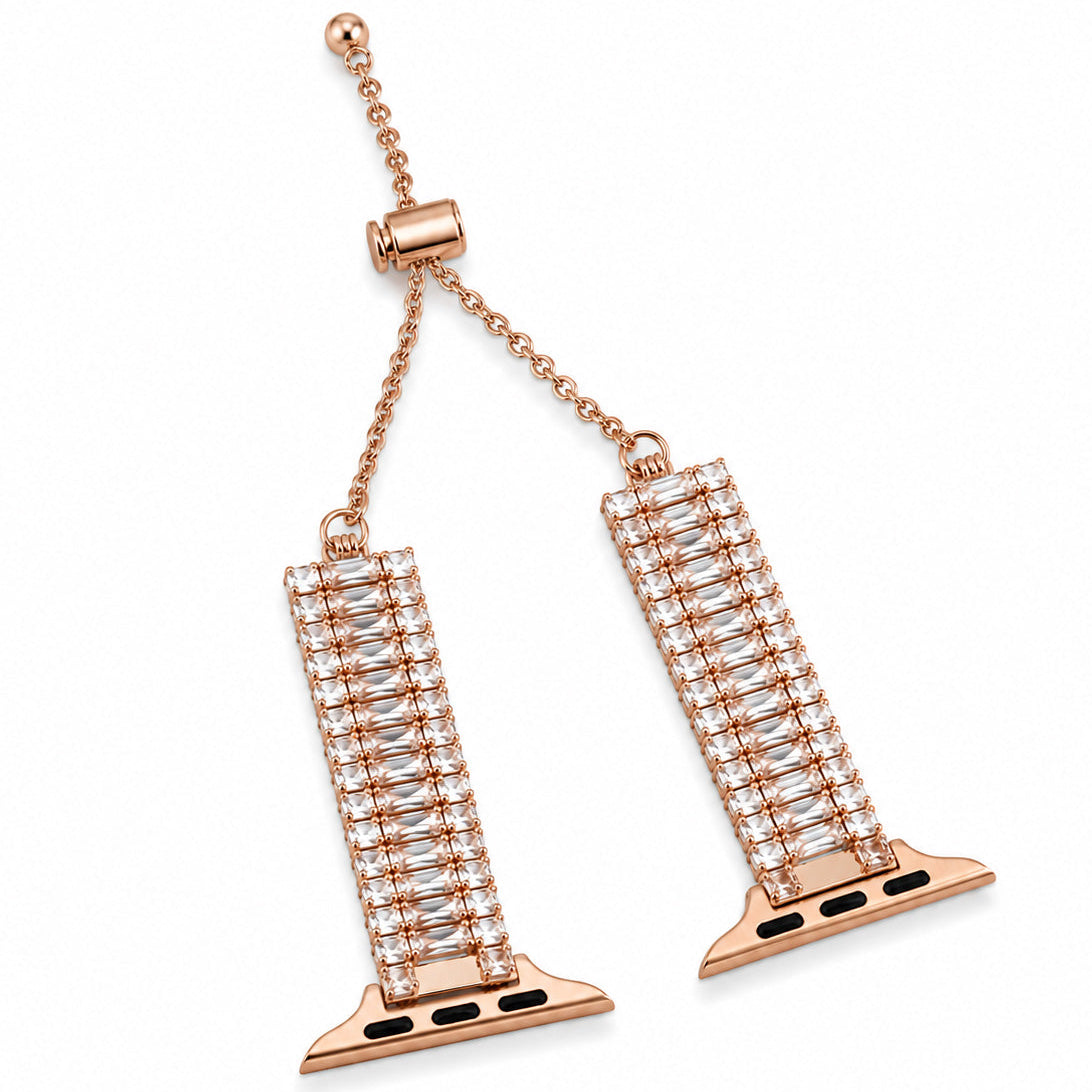 Rose gold-tone watch belt featuring rectangular crystal-studded links and a delicate adjustable chain on a white background.