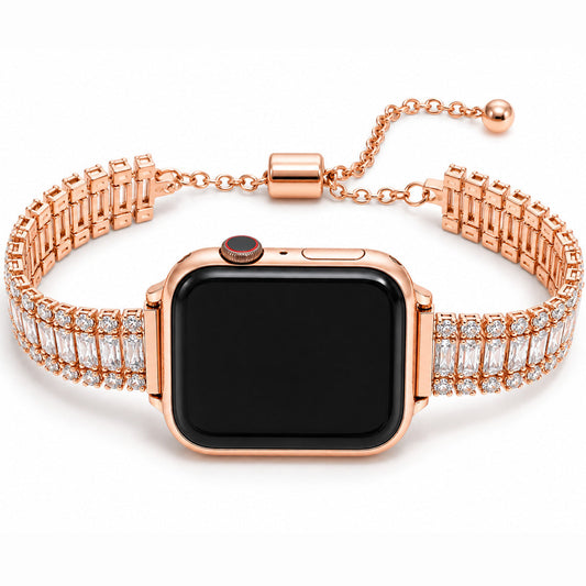 Close-up view of a rose gold smartwatch with a sparkling crystal-studded metal strap and adjustable chain clasp on a white background.