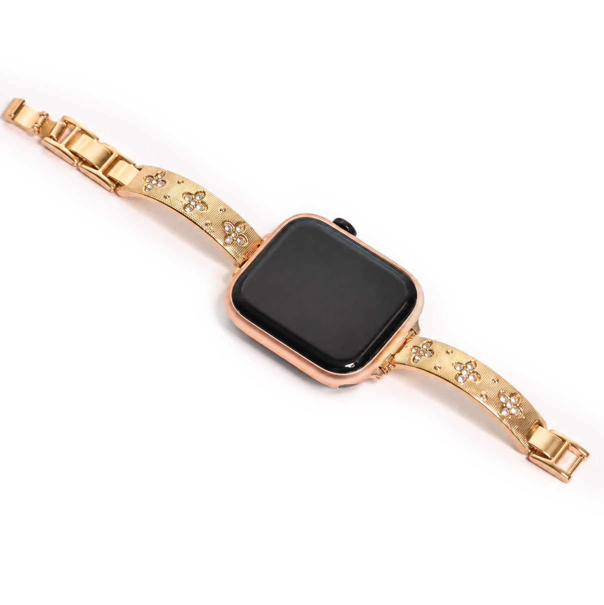 Close-up view of a rose gold smartwatch with a gold floral-patterned metal strap embellished with crystal accents on a white background.