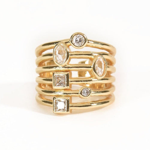 Bold golden spiral ring with mixed-cut crystal detailing and an adjustable anti-tarnish finish, perfect for statement styling, parties, brunch looks, and festive glam.