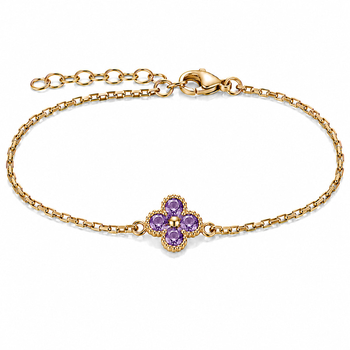 Gold-plated bracelet featuring a delicate four-leaf clover charm with four rich purple stones, set on a fine gold chain with an adjustable extension chain and lobster clasp, displayed against a clean white background.
