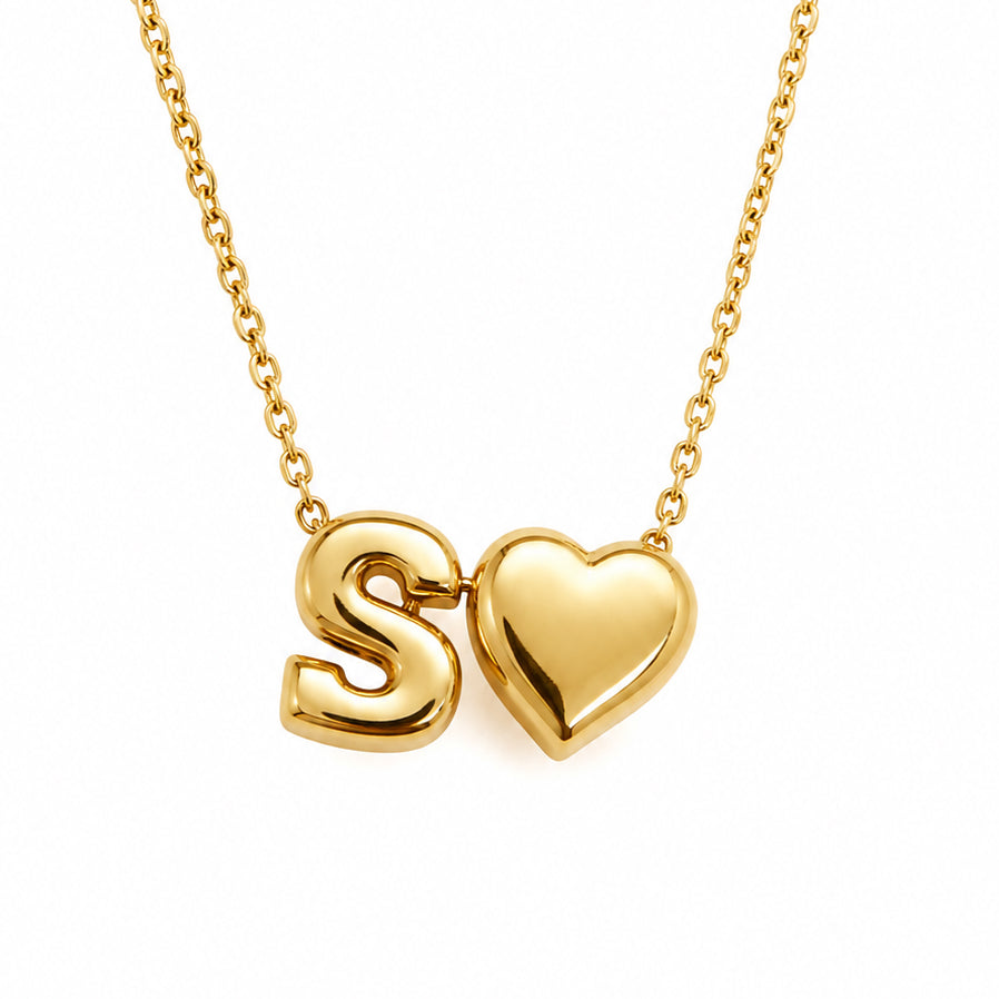 Gold-plated delicate chain necklace featuring a polished S♥ initial-and-heart pendant, displayed on a clean white background.