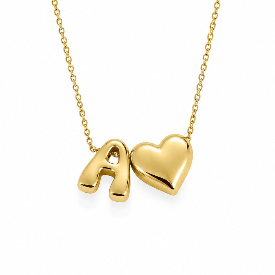 Gold-plated delicate chain necklace featuring a polished A♥ initial-and-heart pendant, displayed on a clean white background.