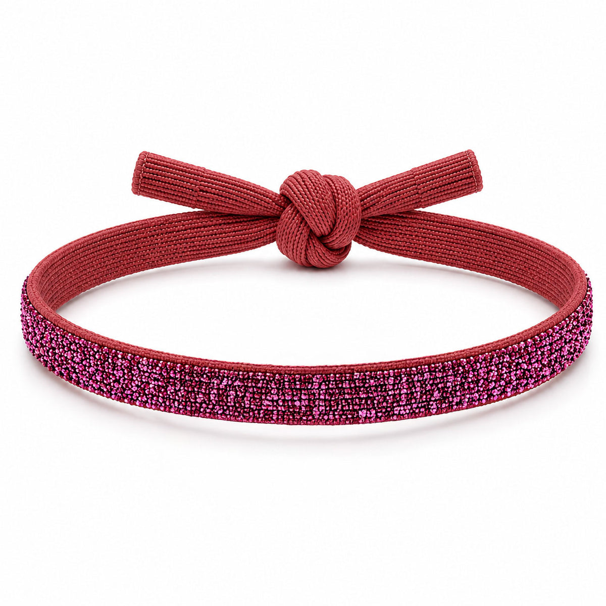 Pink glitter bracelet with a matching deep pink fabric knot, displayed on a clean white background.