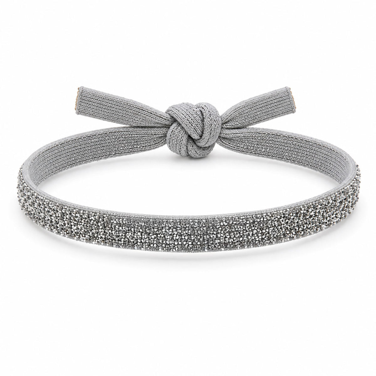 Silver glitter bracelet with a matching silver-grey fabric knot, displayed on a clean white background.