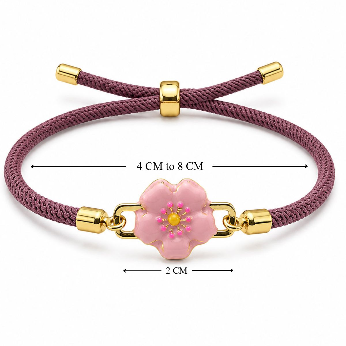 Pink braided cord bracelet with a gold-tone floral pink flower charm, shown on a white background with adjustable 4–8 cm sizing and a 2 cm charm.