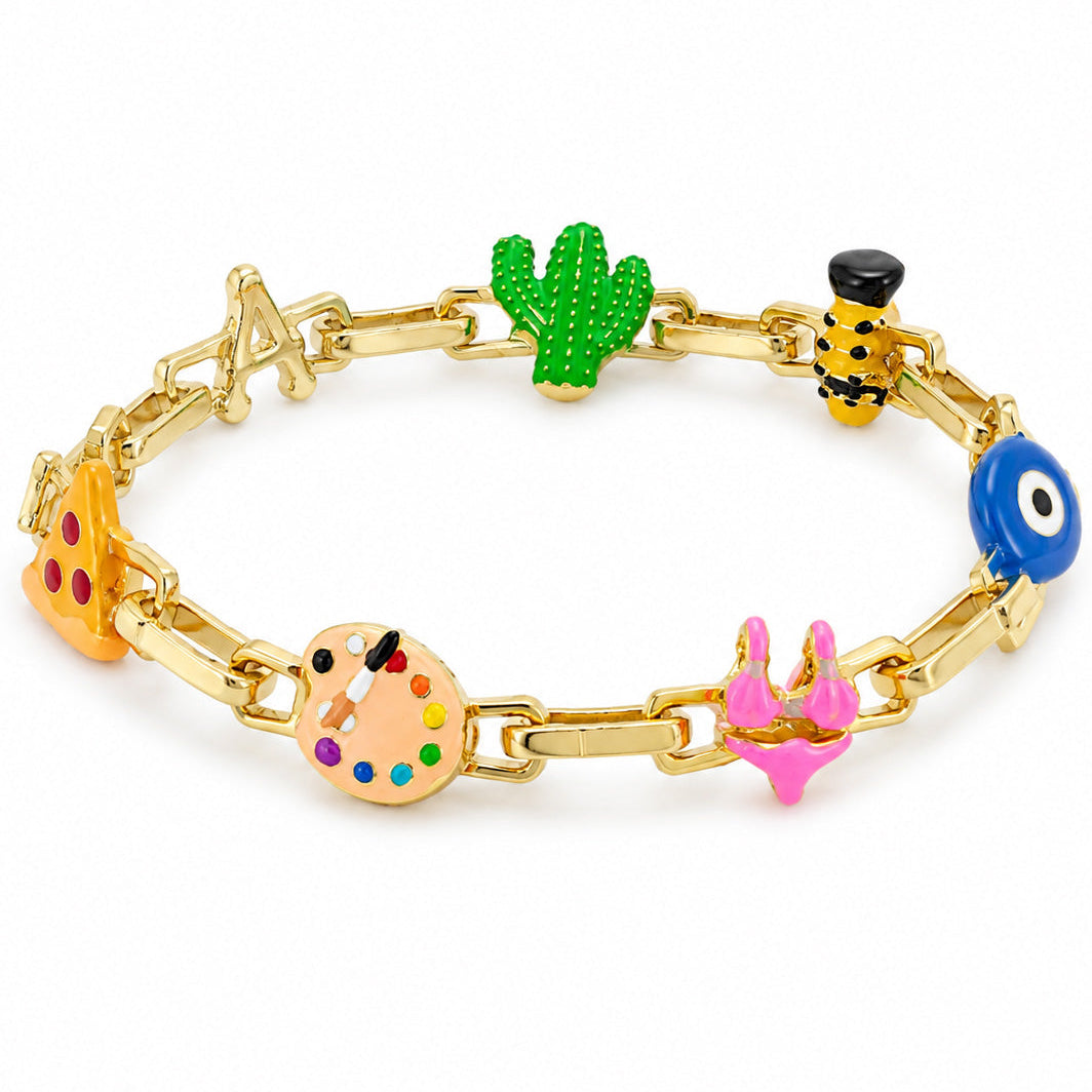 old-tone charm bracelet featuring colorful pizza, letter A, cactus, bee, evil eye, artist palette, and pink bow charms on a chain, displayed on a clean white background.