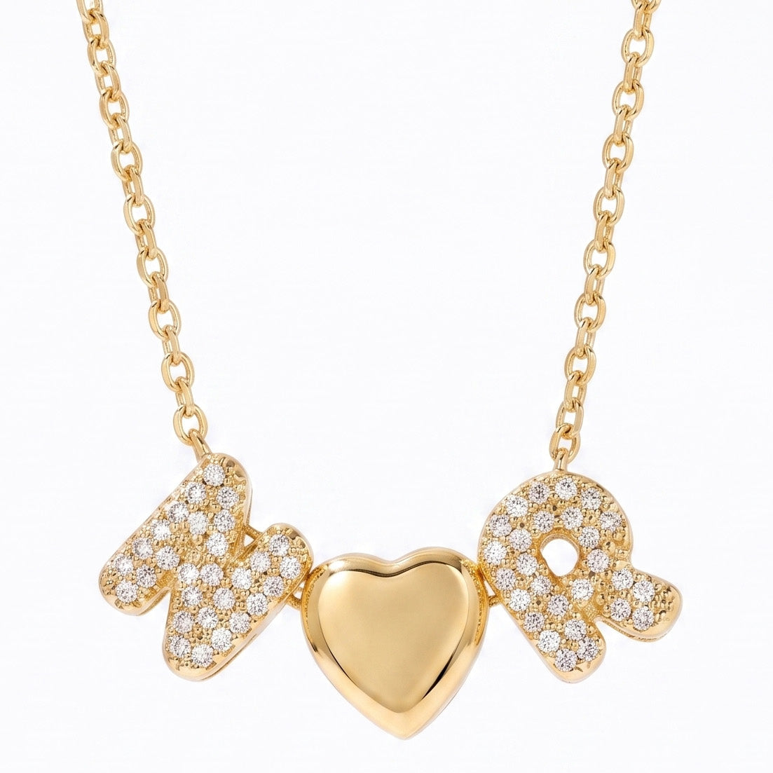A delicate gold link necklace featuring sparkly pave-set rhinestone letter charms spelling "N" and "R" separated by a polished, smooth gold puffy heart pendant.