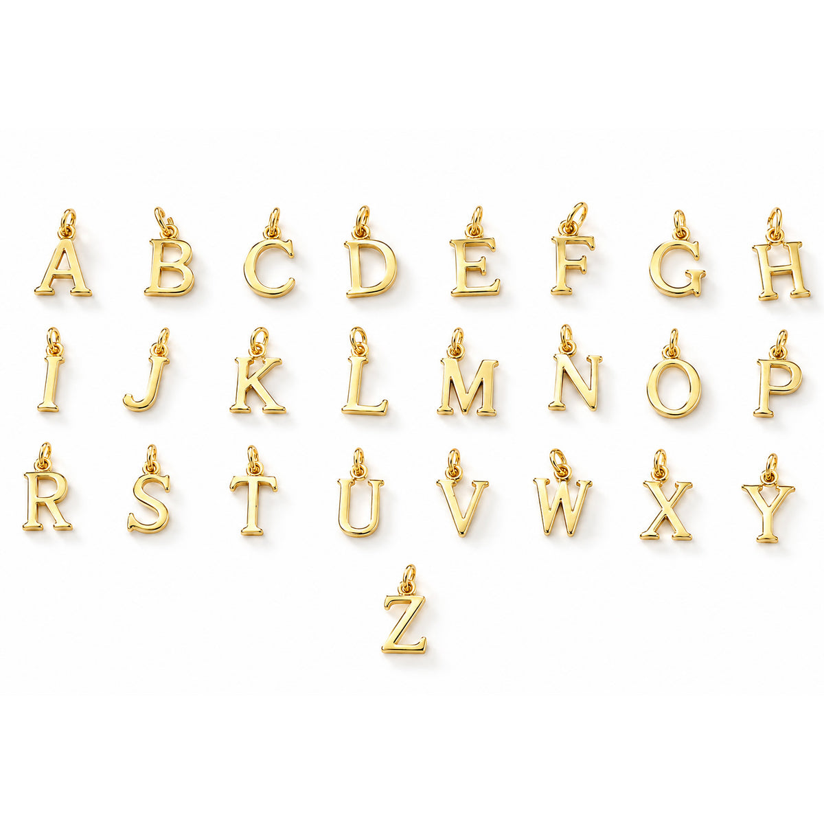 Complete collection of gold-tone alphabet letter charms from A to Z, displayed individually on a clean white background.