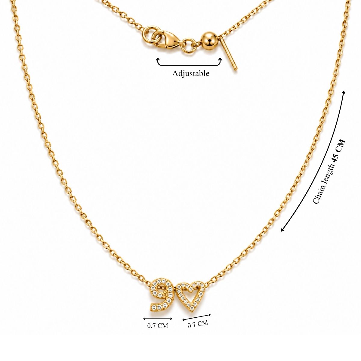Product measurement image showing a gold chain necklace with a total length of 45 cm, an adjustable slider mechanism, and two 0.7 cm rhinestone-encrusted charms representing the number "9" and a heart.