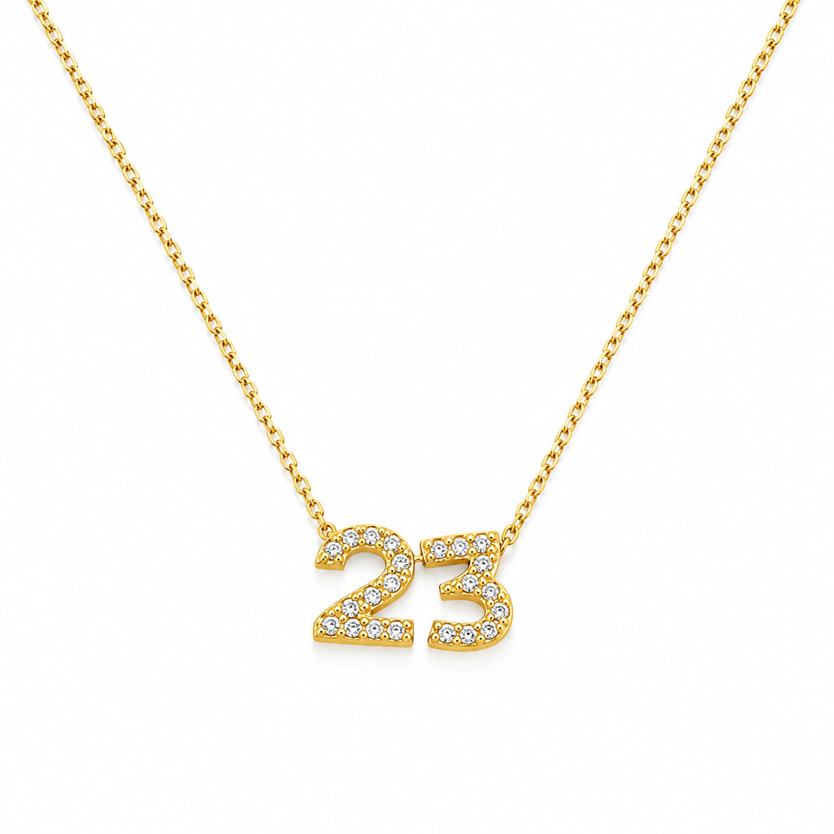 Gold-plated personalized number necklace featuring a sparkling pavé “23” pendant on a delicate gold chain, displayed against a clean white background.
