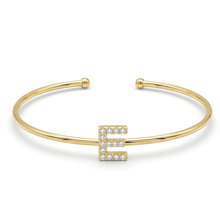 Elegant gold-tone adjustable open cuff bangle featuring a pavé crystal-studded letter E centerpiece. The personalized initial bangle has a sleek polished finish with rounded ball ends and is displayed on a clean white background, making it perfect for everyday wear, stacking, gifting, and personalized jewellery collections.