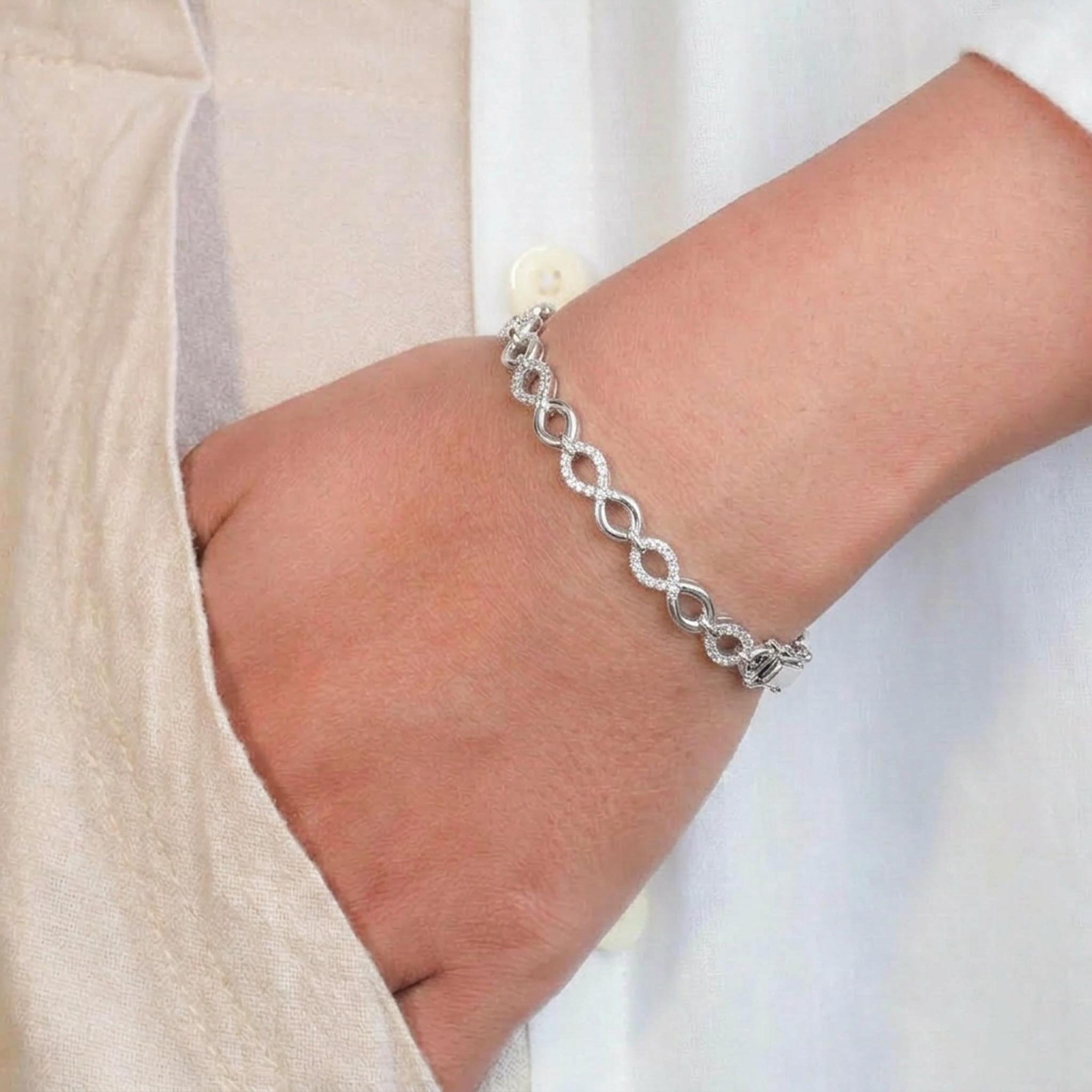 Diamond Infinity 925 Sterling Silver Bracelet featuring alternating infinity-shaped links and pave-set oval motifs