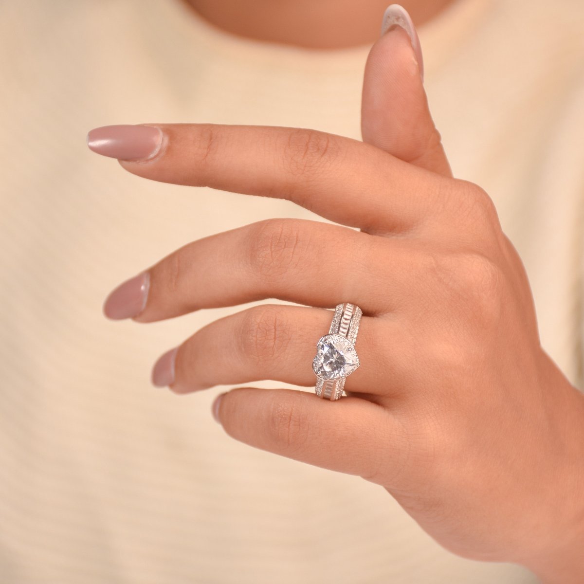 Bold silver heart-cut crystal ring with triple-row stone detailing and an anti-tarnish finish.  a glamorous statement piece perfect for parties, evening wear, and standout styling.
