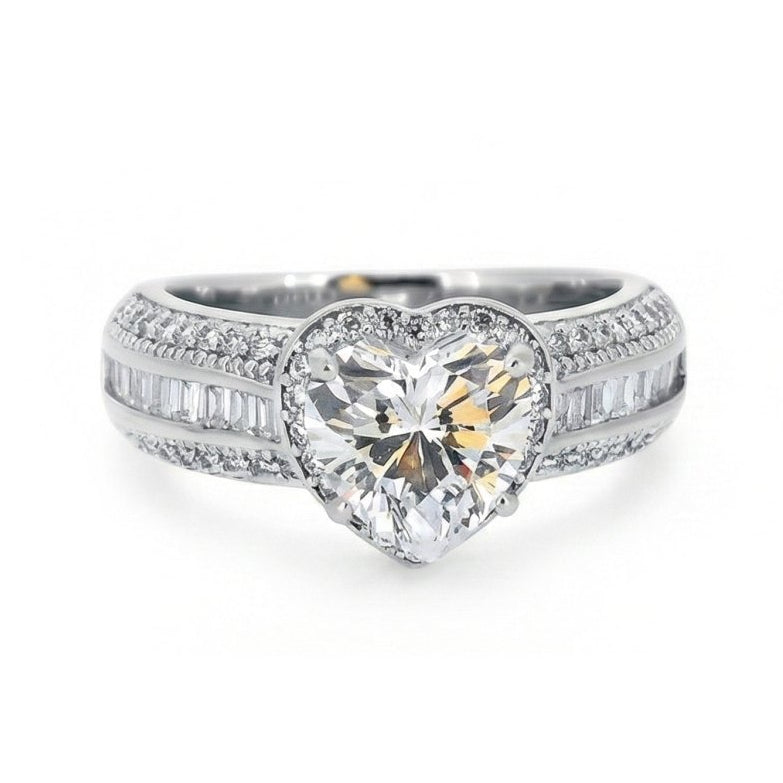 Bold silver heart-cut crystal ring with triple-row stone detailing and an anti-tarnish finish.  a glamorous statement piece perfect for parties, evening wear, and standout styling.
