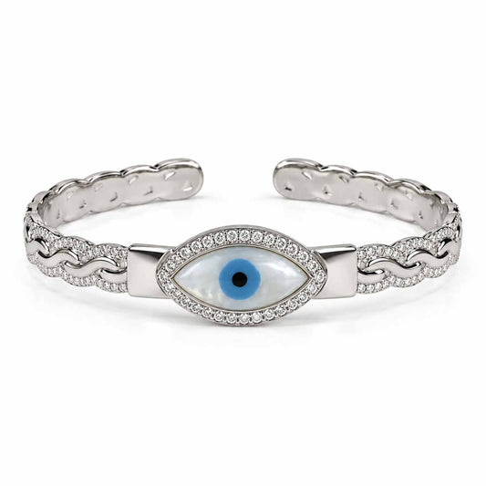 Silver evil eye cuff bangle featuring a blue eye centerpiece, crystal border, and detailed chain-inspired design.
