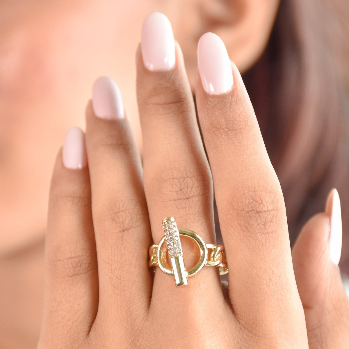Elegant golden clasp-detail ring with a polished anti-tarnish finish and adjustable design, perfect for stacking, modern styling, and everyday glam.

