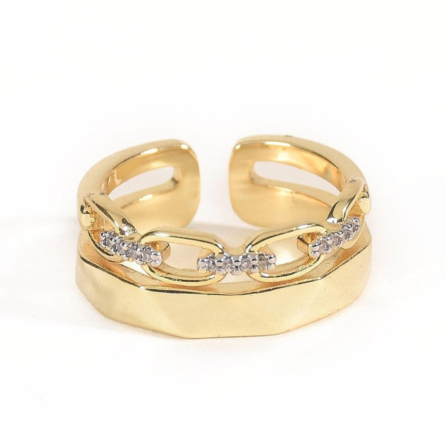 Elegant golden dual-band ring with textured detailing, sparkling pavé accents, and an adjustable anti-tarnish finish, perfect for chic styling, everyday elegance, and thoughtful gifting.
