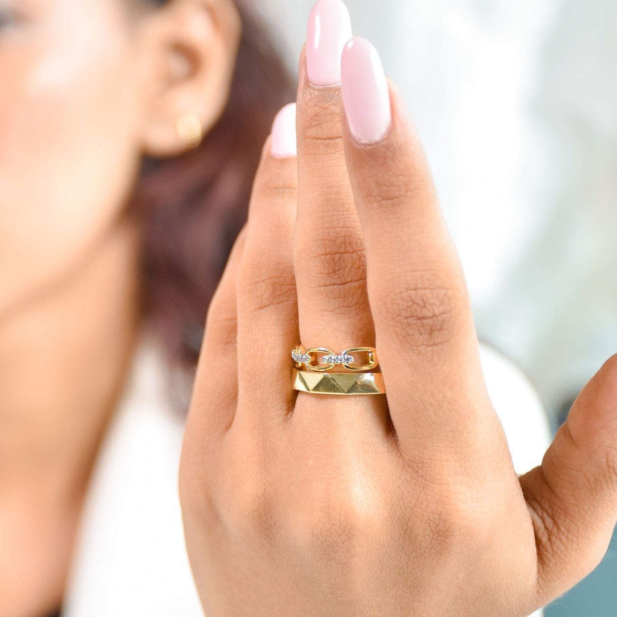 Elegant golden dual-band ring with textured detailing, sparkling pavé accents, and an adjustable anti-tarnish finish, perfect for chic styling, everyday elegance, and thoughtful gifting.
