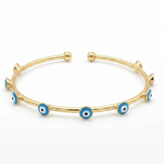 Anti-tarnish yellow gold open cuff bracelet featuring a slender polished band adorned with round bezel-set light blue, white, and black enamel evil eye stations, finished with smooth spherical ball terminals.