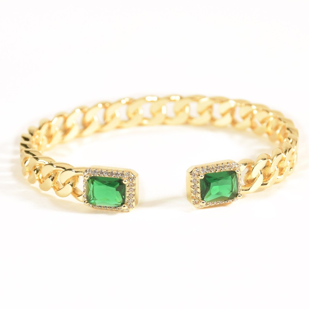 Elegant golden emerald loop bangle with a chic chain-link design and adjustable anti-tarnish finish, perfect for everyday elegance, special occasions, and stylish stacked looks.
