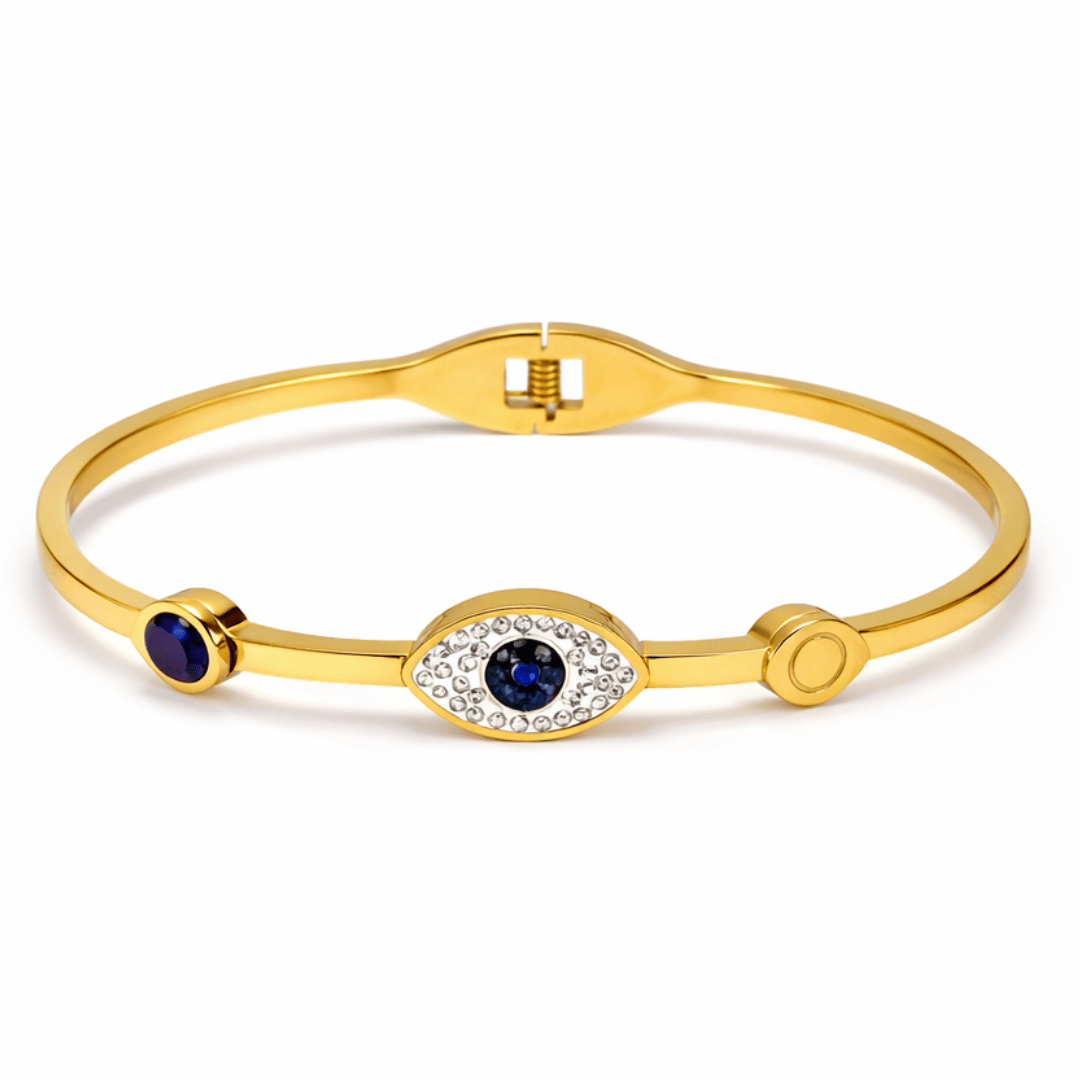 Minimal evil eye bangle with blue enamel and crystal detailing, blending sleek design, protective symbolism, and everyday elegance.