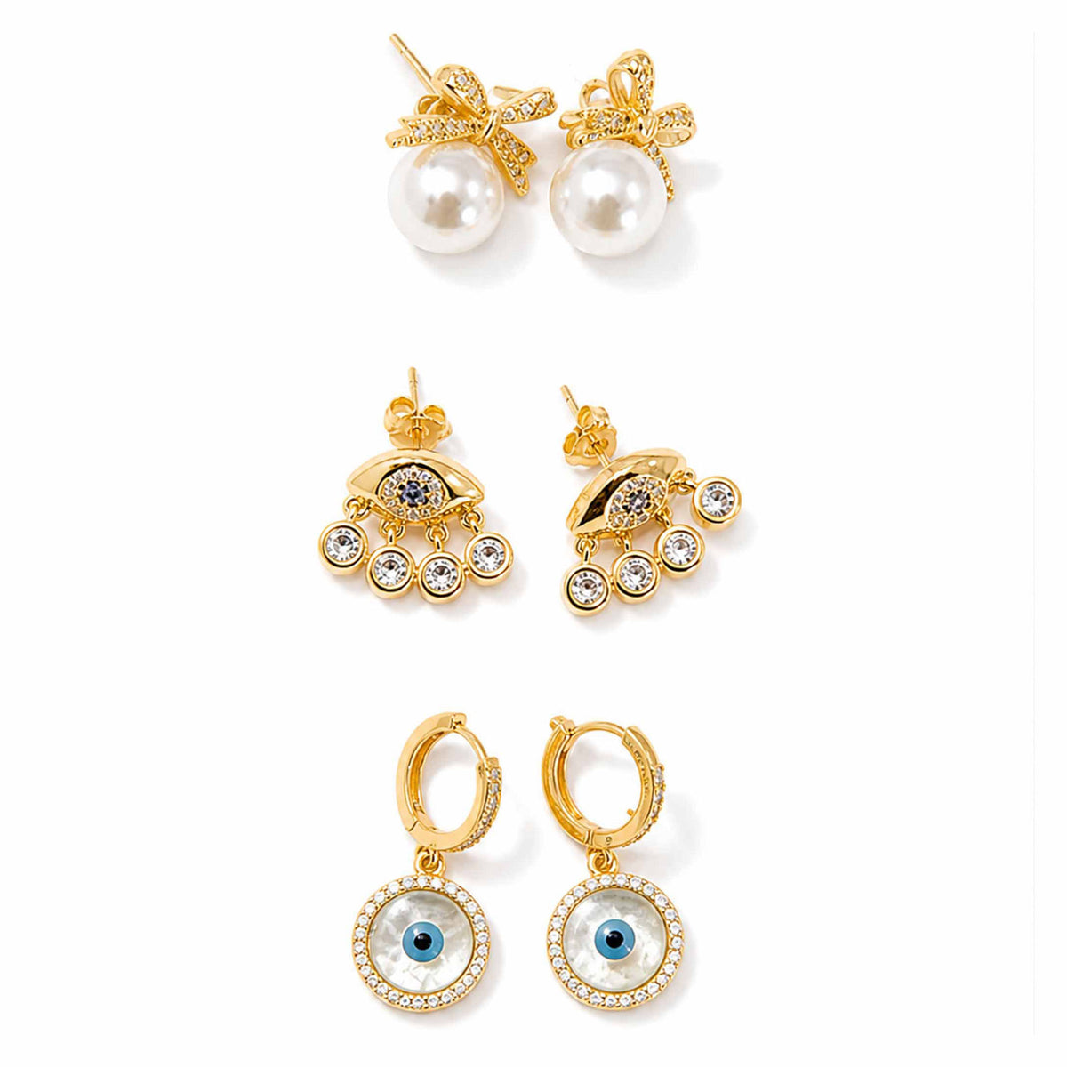 Gold-tone earring stack featuring pearl bow earrings, crystal evil eye dangler earrings, and evil eye hoop earrings displayed separately on a clean white background.