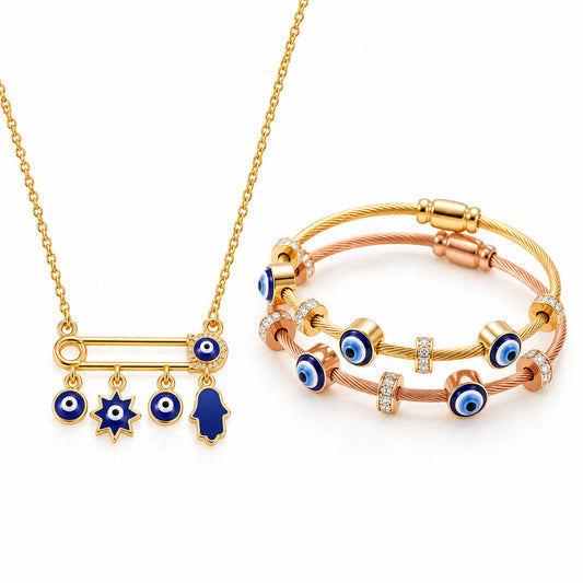 Gold Evil Eye necklace with a safety pin charm and dangling blue enamel charms paired with two stacked cable bracelets in gold and rose gold, featuring blue Evil Eye beads, crystal accents, and adjustable sliding clasps for a stylish anti-tarnish everyday stack.