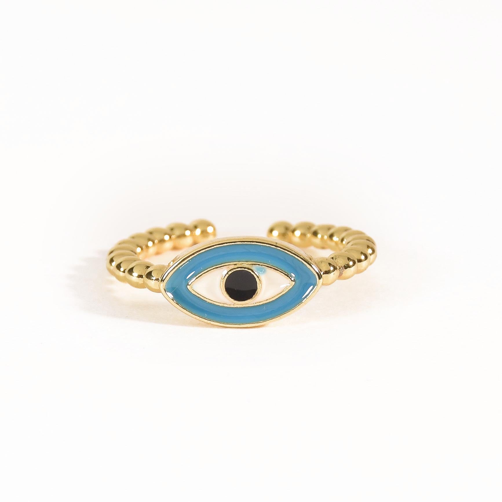A trio of adjustable gold-toned rings stacked together, featuring a pastel evil eye centerpiece, a sparkling stardust band, and a delicate star-inspired ring.