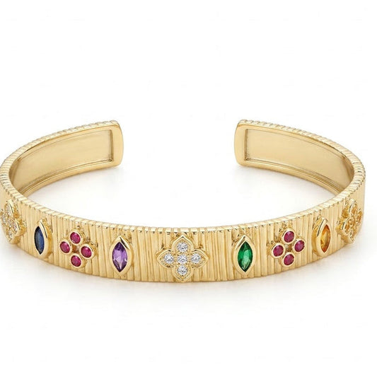 Elegant gold-tone adjustable open cuff bangle featuring a textured ribbed finish with colorful marquise and round gemstone accents, highlighted by a sparkling crystal floral motif at the center. The anti-tarnish statement bangle is displayed on a clean white background, making it perfect for everyday wear, festive occasions, stacking, and gifting.