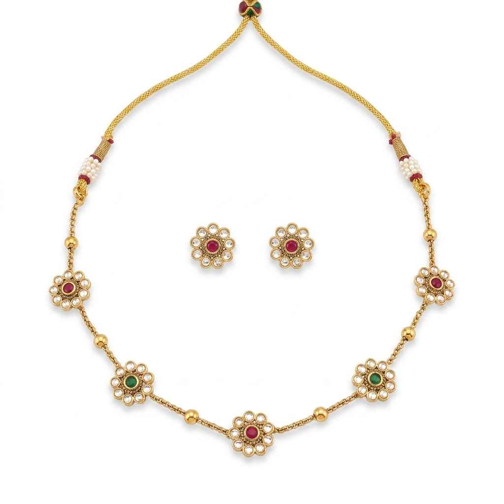 Floral kundan necklace set with pearl accents and red green stones with matching stud earrings