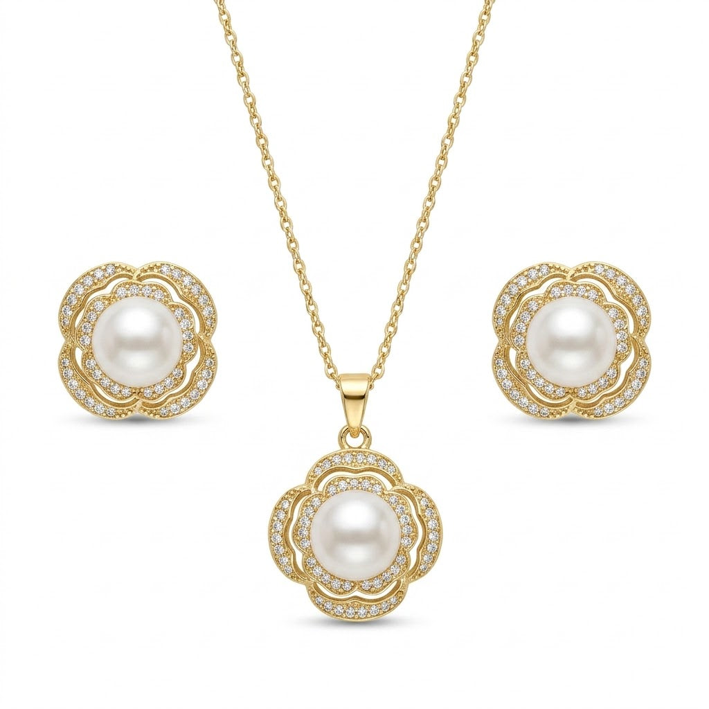 Anti-tarnish gold jewelry set featuring a pendant necklace with a lustrous white pearl surrounded by a double floral pave crystal halo, paired with matching pearl stud earrings.