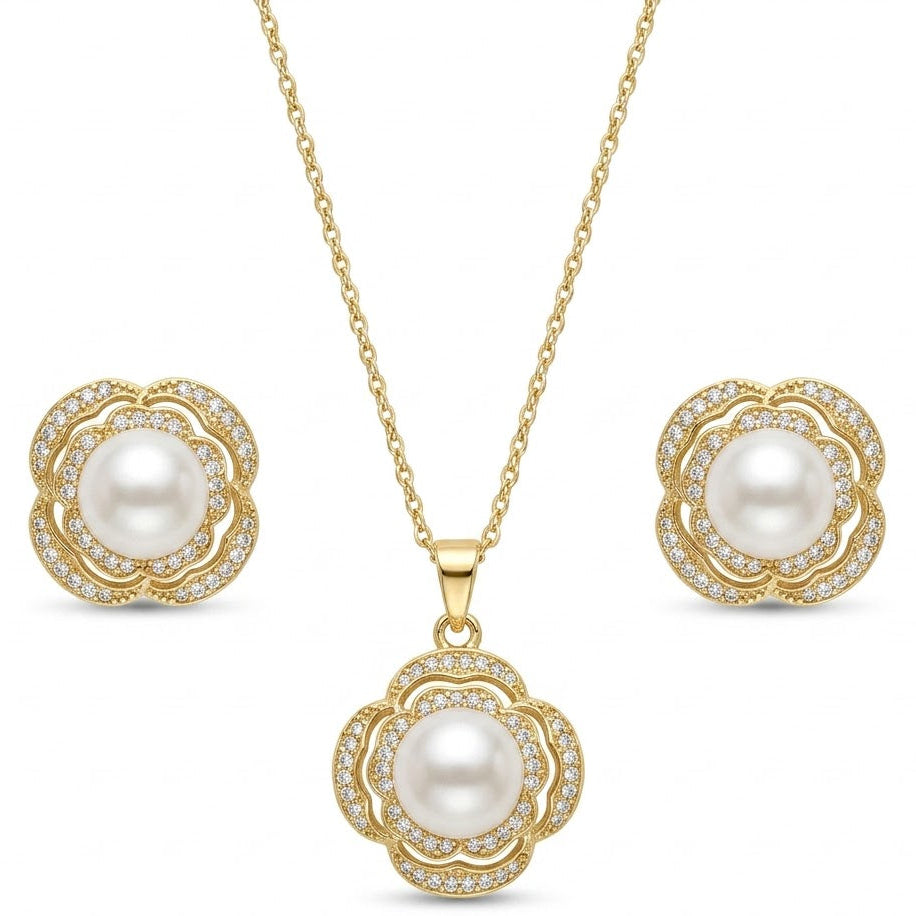 Anti-tarnish gold jewelry set featuring a pendant necklace with a lustrous white pearl surrounded by a double floral pave crystal halo, paired with matching pearl stud earrings.