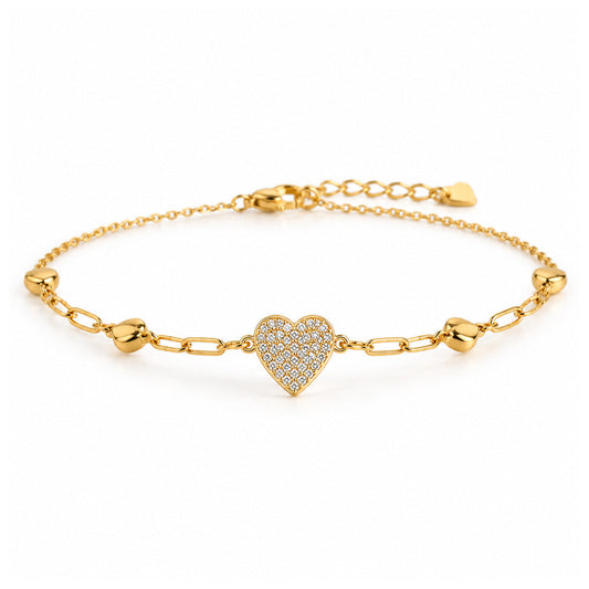 Gold-tone chain anklet with a heart-shaped charm covered in sparkling clear crystals, polished gold heart-shaped accents, and an adjustable extension chain on a clean white background.