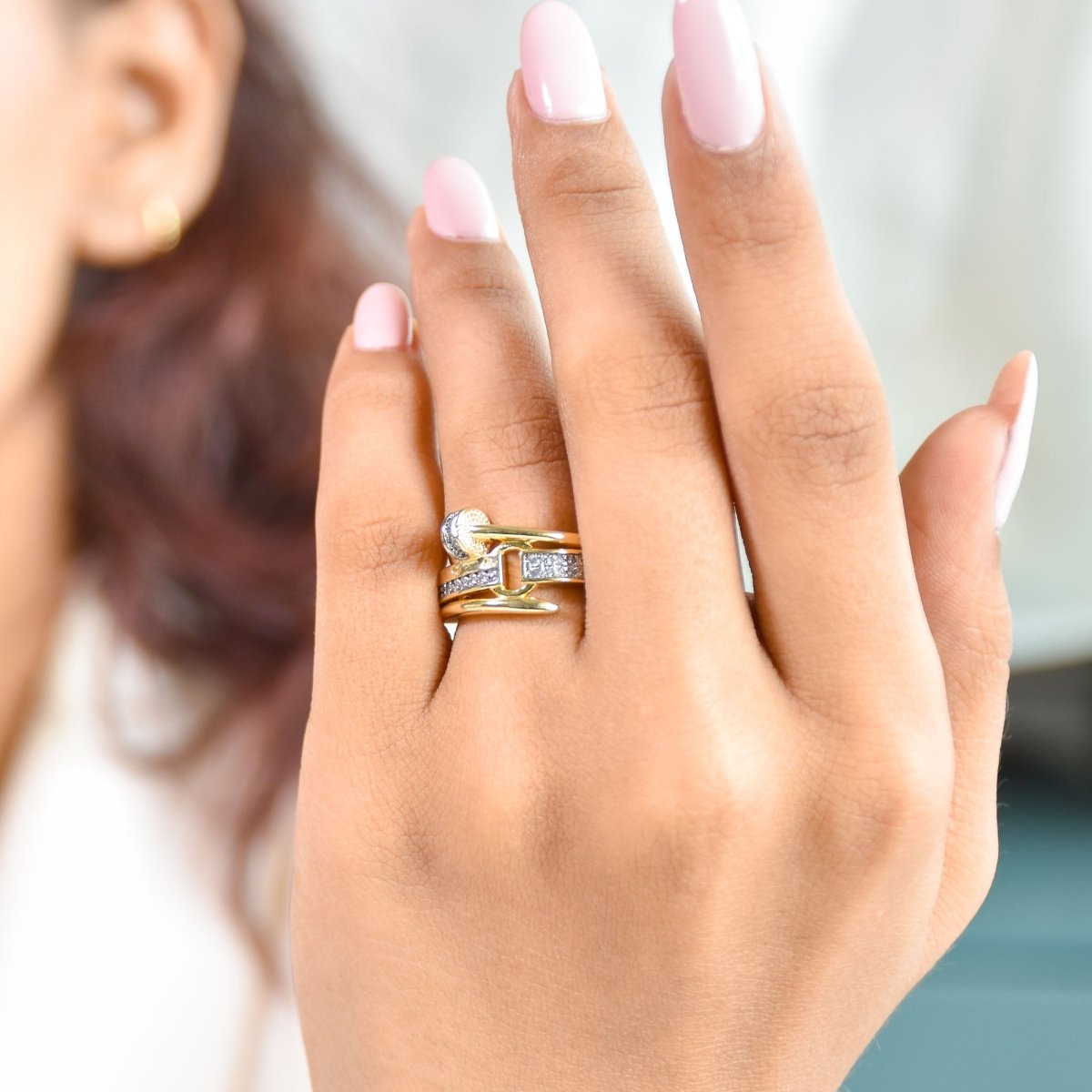 Bold golden nail-inspired ring with sparkling pavé detailing and an adjustable anti-tarnish finish, perfect for modern statement styling and standout gifting.
