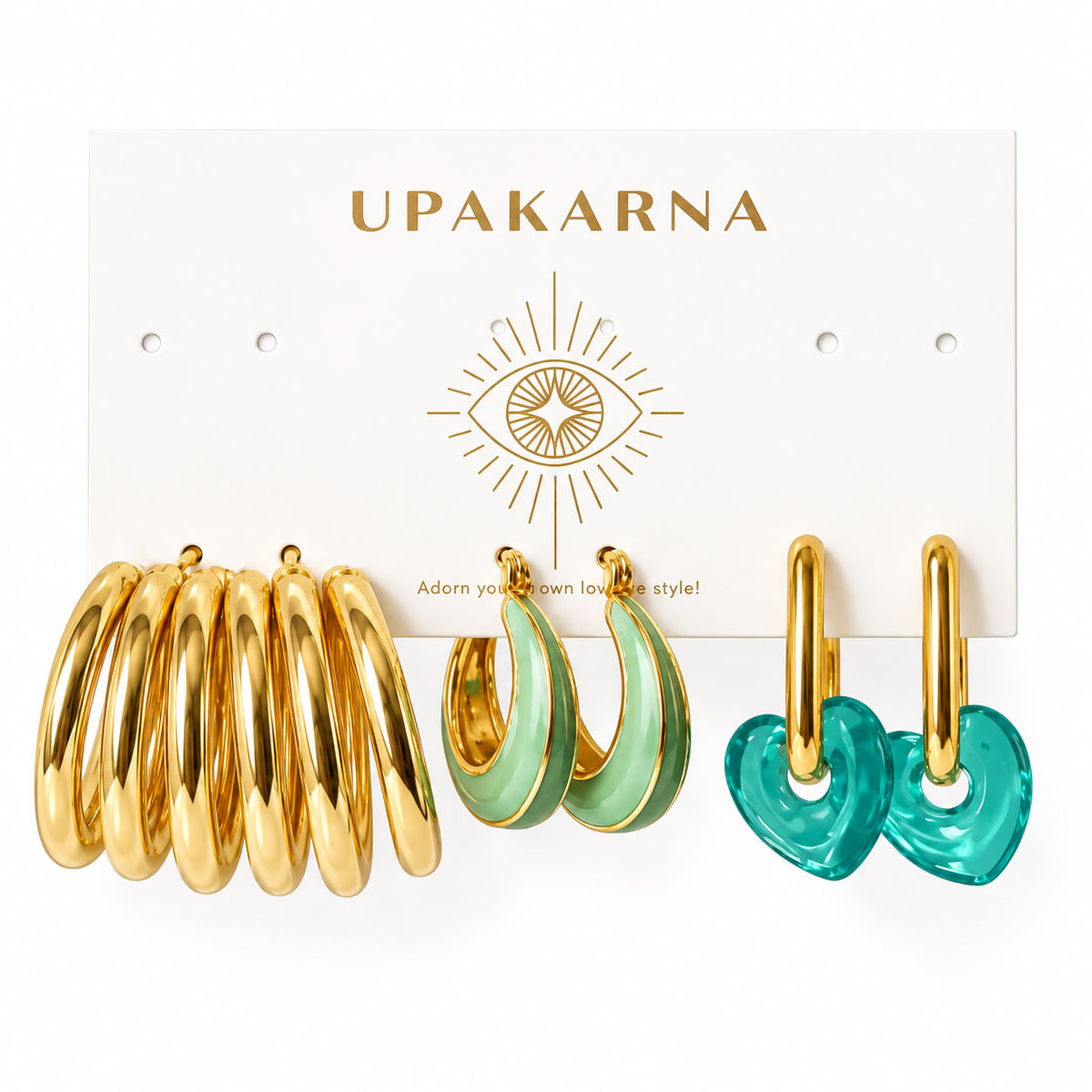 Three pairs of statement hoop earrings displayed on an Upakarna jewellery card, featuring chunky gold tube hoops, mint green teardrop enamel hoops with gold edges, and translucent teal heart drop hoops with gold-plated hoops, arranged on a clean white background with a premium polished finish.