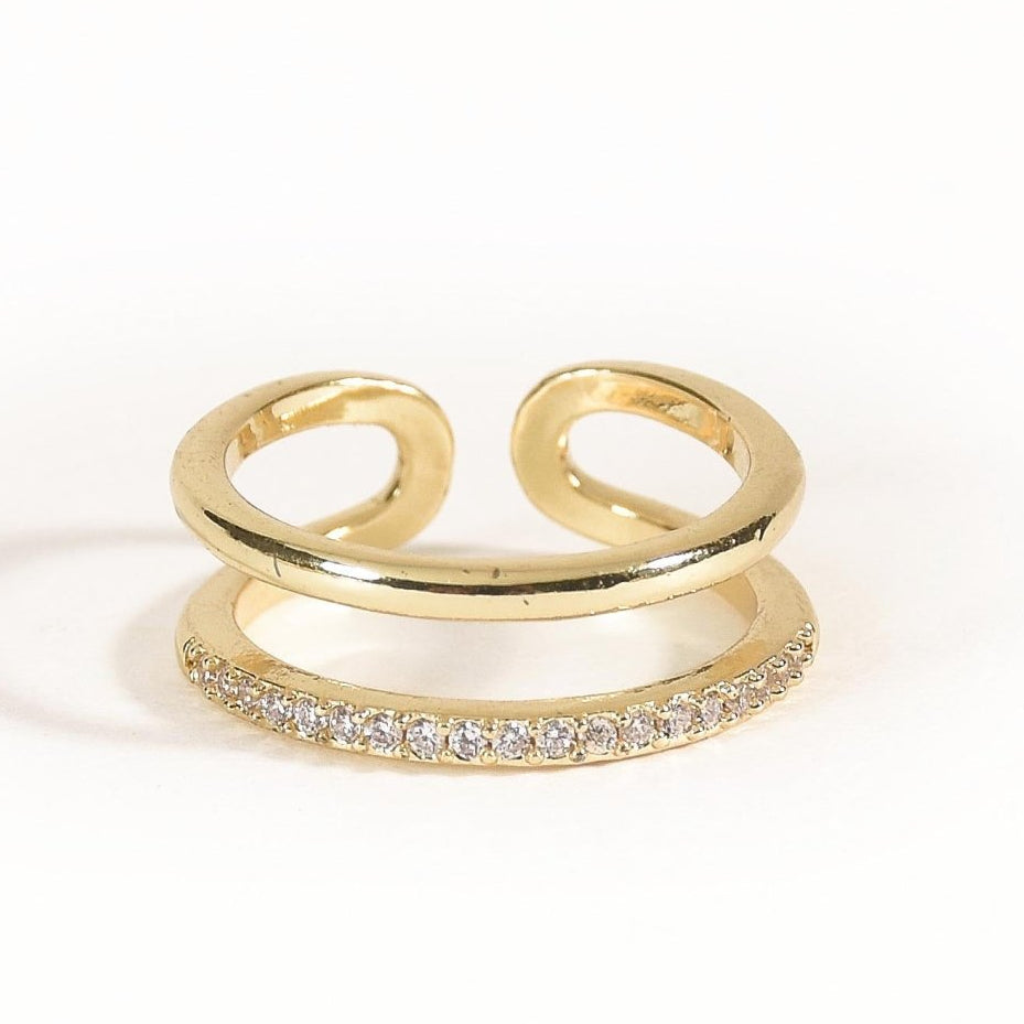 Elegant golden band ring with a sleek polished finish, subtle sparkle, and adjustable anti-tarnish design, perfect for everyday wear, effortless stacking, casual outings, parties, and adding a touch of glam to any look.
