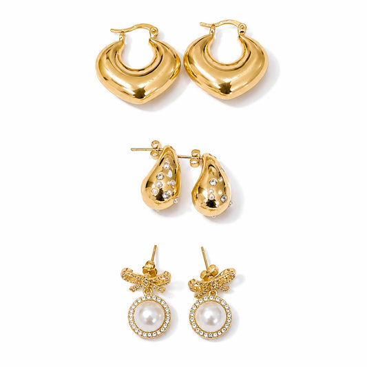 Gold-tone earring stack featuring polished hoops, sparkling embellished teardrop earrings, and pearl bow dangler earrings displayed separately on a clean white background.