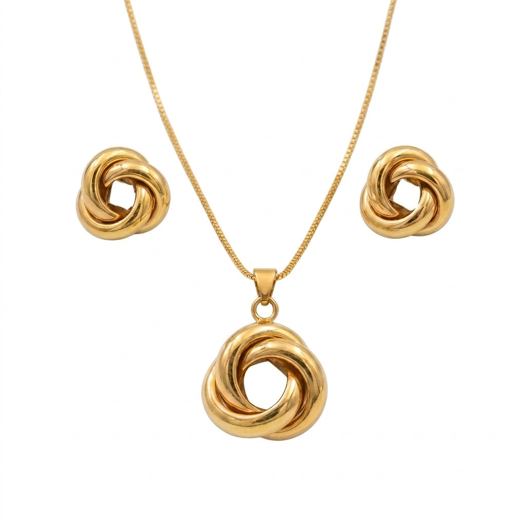 Anti-tarnish yellow gold jewelry set featuring a fine, rounded box chain necklace with an openwork love knot pendant formed by three thick, overlapping polished gold rings, paired with matching three-dimensional interlocked ring knot stud earrings.