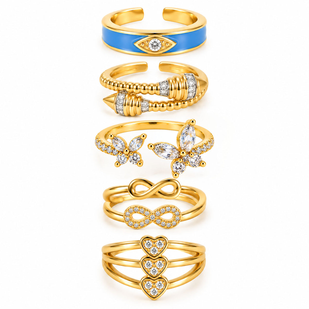 Five gold rings featuring a blue evil eye enamel ring, a bold wraparound beaded ring, a sparkling butterfly open ring, a layered infinity ring set, and a triple-heart pavé ring on a clean white background.