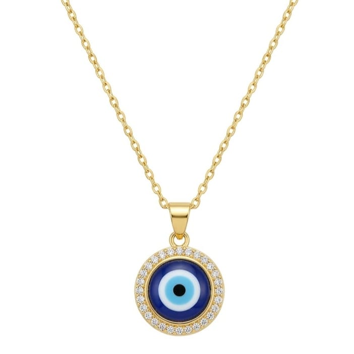 A gold necklace featuring a round Evil Eye pendant suspended on a fine gold chain. The pendant has a black center pupil, light blue inner ring, and dark navy outer ring, framed by a sparkling halo of clear stones. The jewelry is centered on a clean white square background with a dark gray frame.