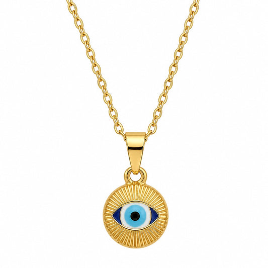 A gold necklace featuring a circular pendant with textured, radiating sunbeam lines. The center showcases an eye shape with a black pupil, light blue iris, and dark blue corners, suspended from a gold chain. The piece is displayed against a clean, solid white square background surrounded by a dark border.