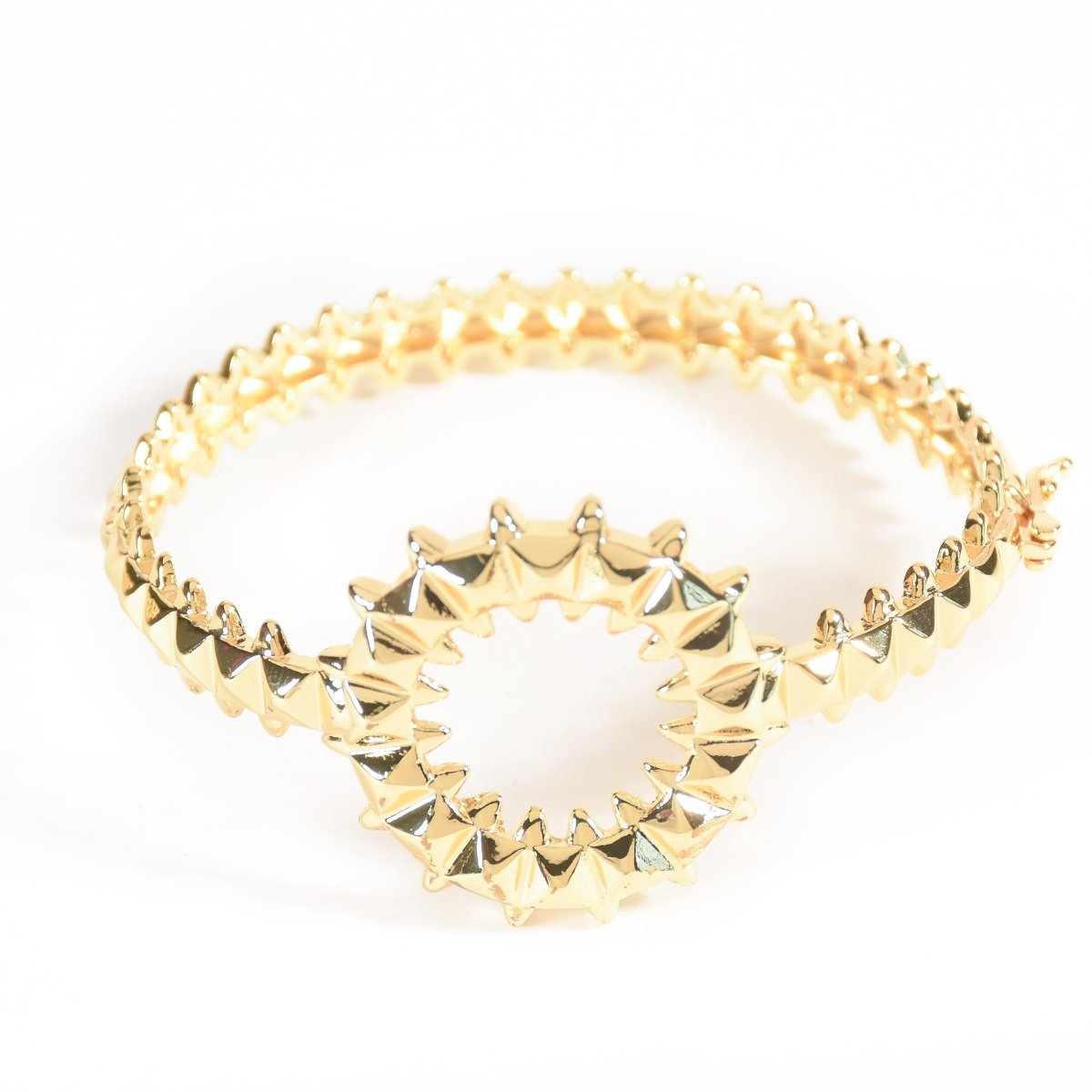 Bold golden spiked-design bangle with an anti-tarnish finish and openable clasp style, perfect for party wear, casual glam, and statement styling.
