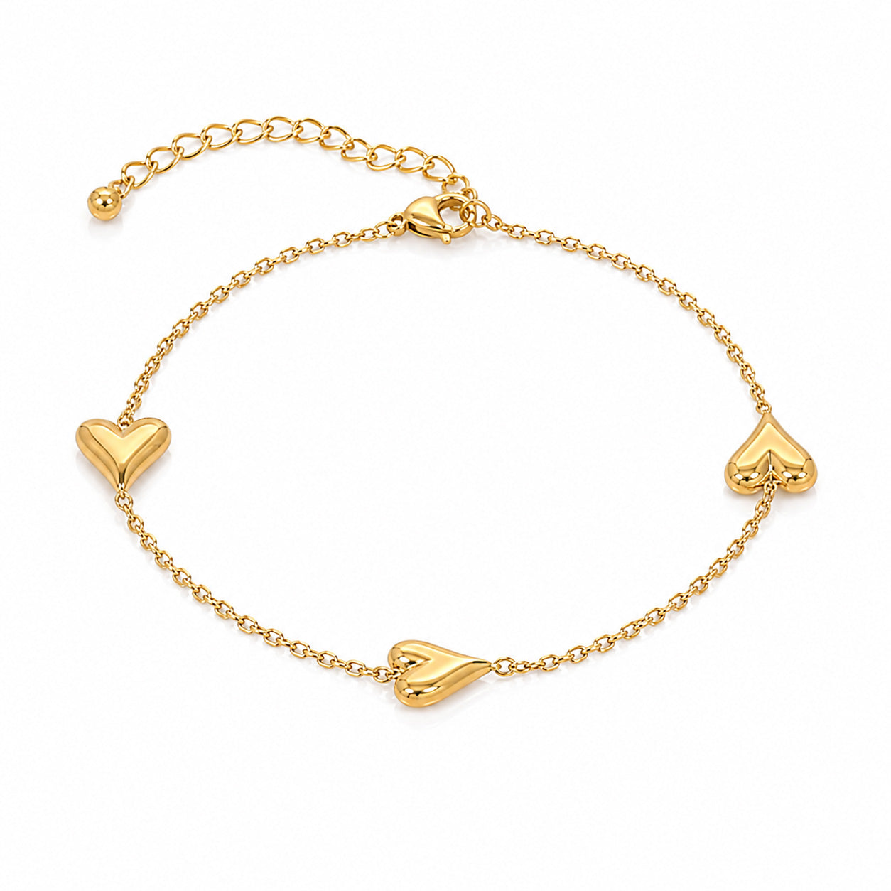 Gold-tone heart charm bracelet featuring three polished heart motifs on a delicate adjustable link chain, displayed on a white background.